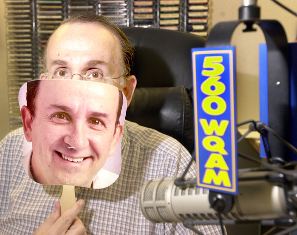 Neil Rogers with a mask of himself